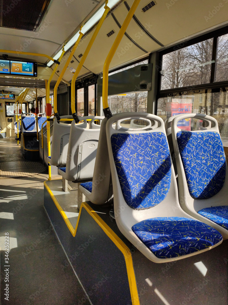 Obraz premium Empty bus. Translation of text on the screen: weather forecast for today, tuesday, morning, afternoon - cloudy, evening - cloudy