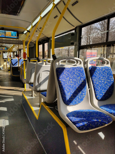 Empty bus.  Translation of text on the screen: weather forecast for today, tuesday, morning, afternoon - cloudy, evening - cloudy