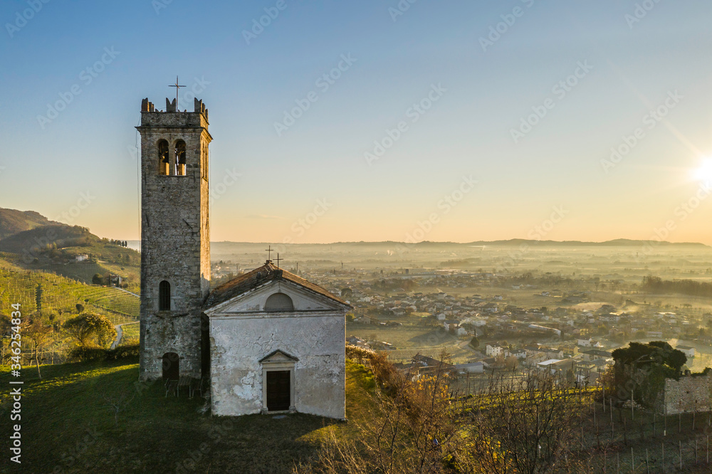 Little church on italian hills at dawn