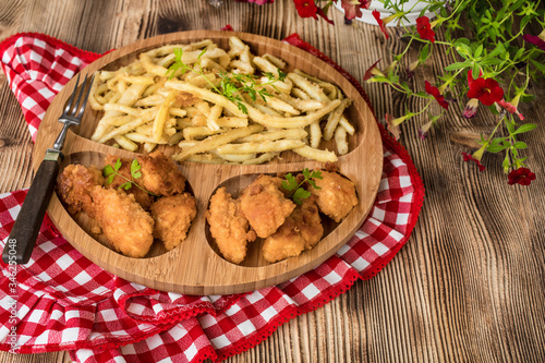 Chicken nuggets with yellow beans.