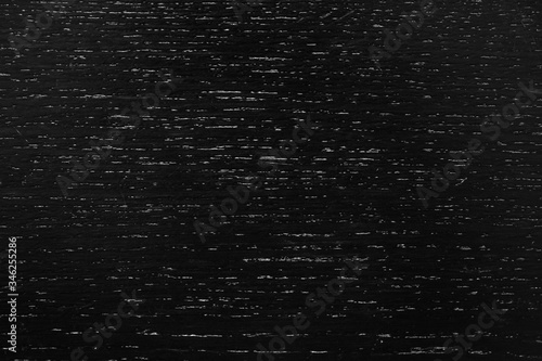 Black wood texture as background. Top view.