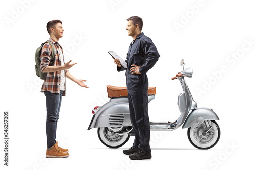 Motorbike mechanic and a guy with a scooter having a converastion