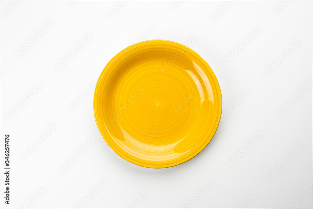 Empty yellow plate isolated on white background Empty yellow plate isolated on white background