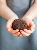Child holding buckwheat flour cookie
