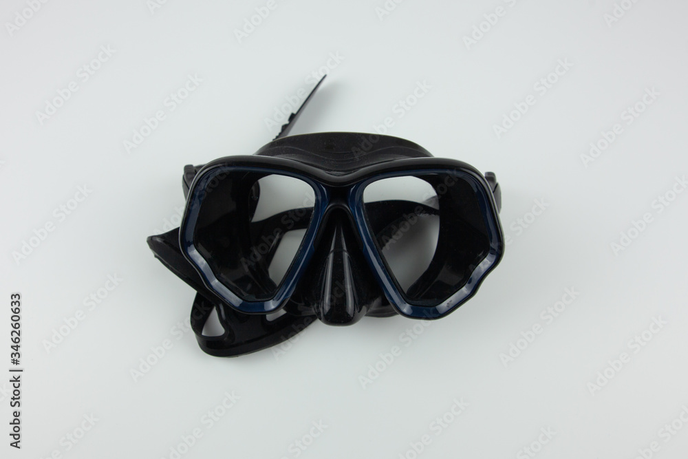 Black mask for snorkeling on a white background. Equipment for outdoor activities Black mask for snorkeling on a white background. Equipment for outdoor activities