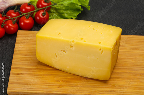 Hard yellow tasty cheese brick