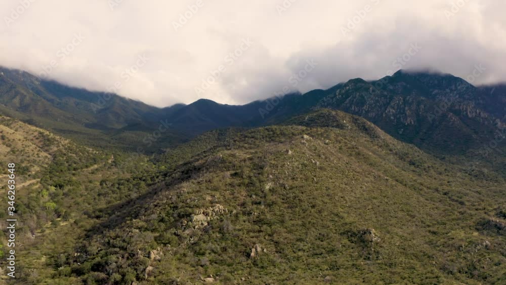 The Santa Rita Mountain Range In Clouds In Arizona By Madera Canyon - aerial drone shot The Santa Rita Mountain Range In Clouds In Arizona By Madera Canyon - aerial drone shot
