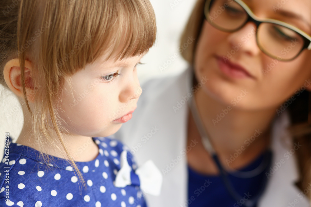 Little child with mother at pediatrician reception Little child with mother at pediatrician reception