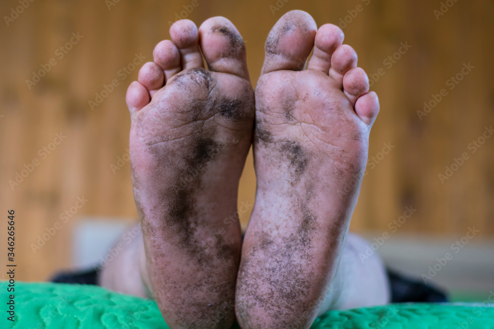 Fototapeta premium dirty feet, heels, after dirty work. working