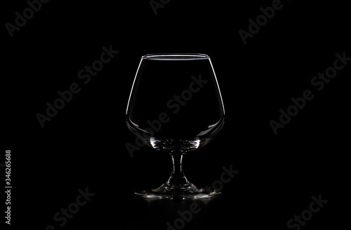 empty glass on black background, copy space
