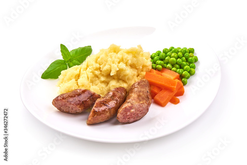 Baked sausages with mashed potatoes, isolated on white background