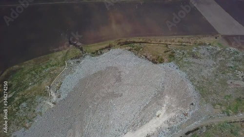 Lots of plastic, waste garbage at landfillsite. Aerial view of city dump. A huge garbage dump. Birds circling over the garbage. Save planet photo