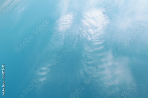 Blue sky with white clouds that form the wings of an angel. Concept landscape  abstraction.