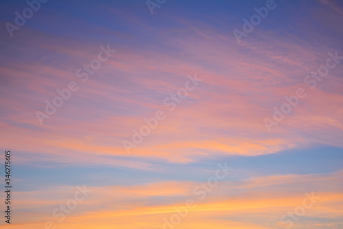 Blue sky at sunset with bright stains of orange and pink. Concept landscape, abstraction. © Chetgal 