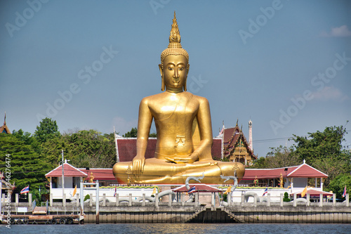 A giant golden Buddha statue in Maravijaya attitude