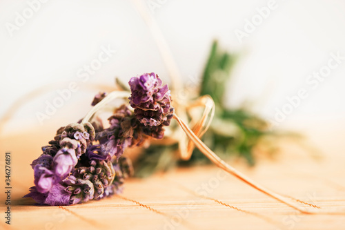 Lavender on bamboo place mat. Studio shot against white background.