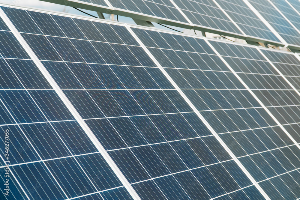 Innovative solar batteries on the field. Solar power plant in summer. Concept of green energy, clean energy, renewable energy Innovative solar batteries on the field. Solar power plant in summer. Concept of green energy, clean energy, renewable energy