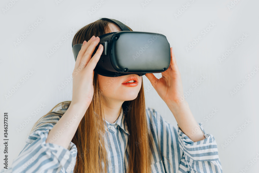 vr glasses. girl in VR glasses on a white background mmersion in virtual reality, augmented reality glasses. girl holding VR glasses vr glasses. girl in VR glasses on a white background mmersion in virtual reality, augmented reality glasses. girl holding VR glasses