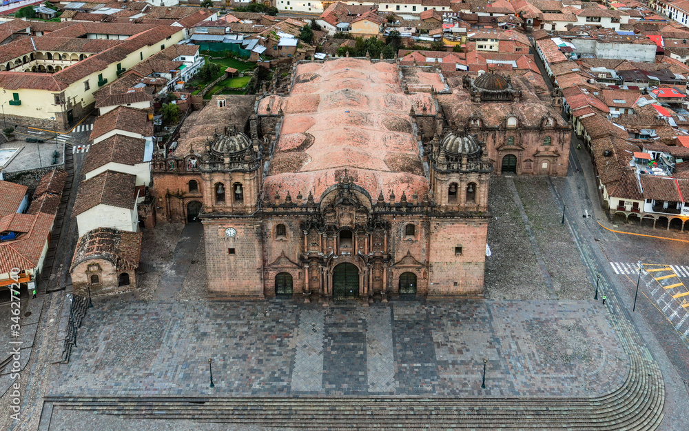 Daytime aerial view over Cusco Cathedral also known as The Cathedral Basilica of the Assumption of the Virgin during Coronavirus lockdown.