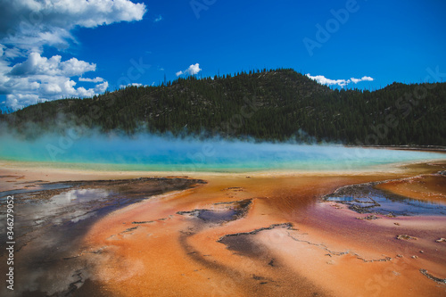 Grand prismatic spring in Yellowstone national park  United States of America. Memory card from vacation  travel background  Wyoming nature landscape   colorful geyser. World famous landmarks. 