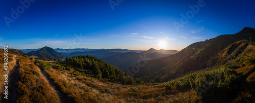 Sunrise in mountains © mykolastock