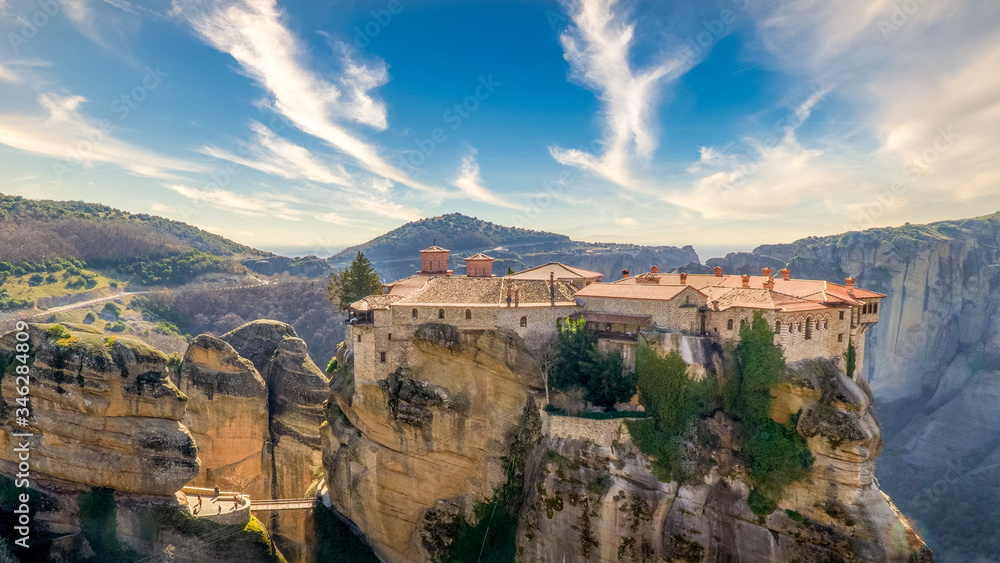 The monastery in the rock is at Meteora Greece the water and the time gave that shape to the rocks and made them one of the most famous attractions in the world