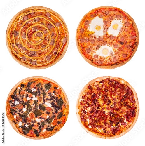 Set of four tasty pizza, isolated on a white background, top view. Pizza Salsiccia, pizza with sausages and eggs, pizza with feta, spinach and olive and pizza Mexico