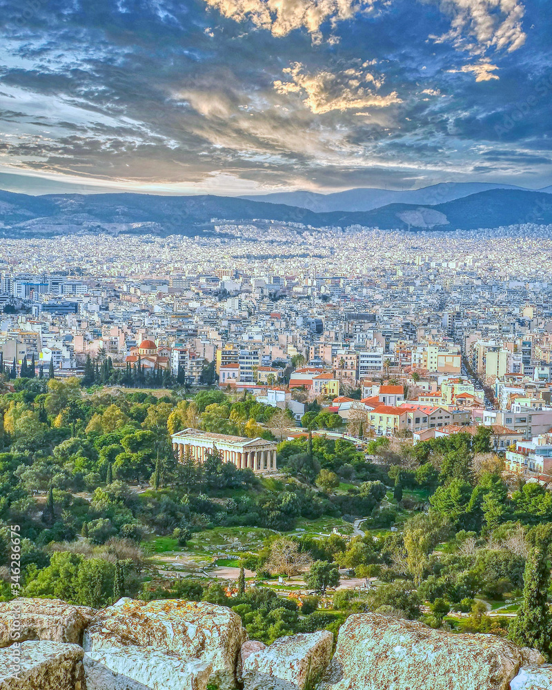 Ancient Athens the capital of Greece and the center of the world in the ancient times .great architecture masterpieces and beautiful sky with clouds
