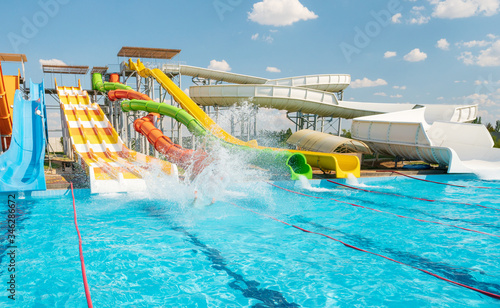 Water park with colorful slides and pools photo