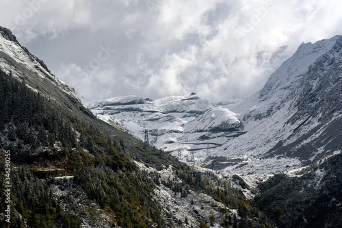 Beautiful winter landscape. Mountain road leading to mountain peaks in the snow. Transfagarasan, Romania.