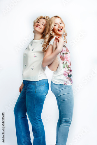 mother with teen daughter together posing happy smiling isolated on white background with copyspace, lifestyle people concept