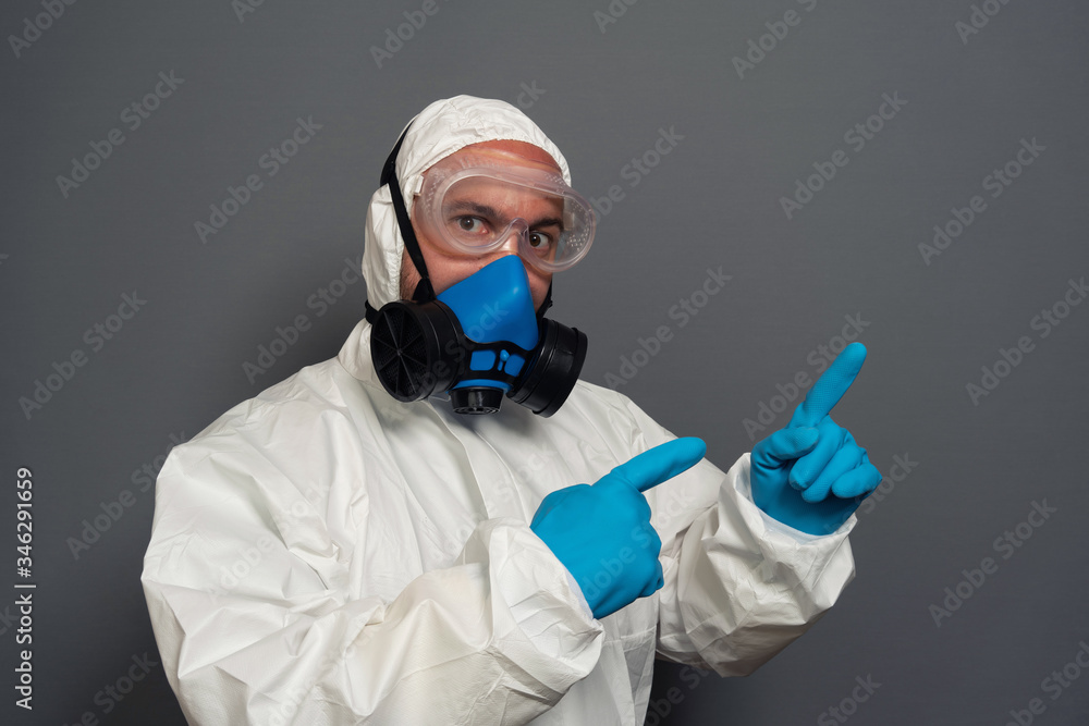 epidemic specialist guy disinfectant control public places disinfecting cleaning arms crossed wear hazmat protective suit goggles mask isolated grey color background epidemic specialist guy disinfectant control public places disinfecting cleaning arms crossed wear hazmat protective suit goggles mask isolated grey color background