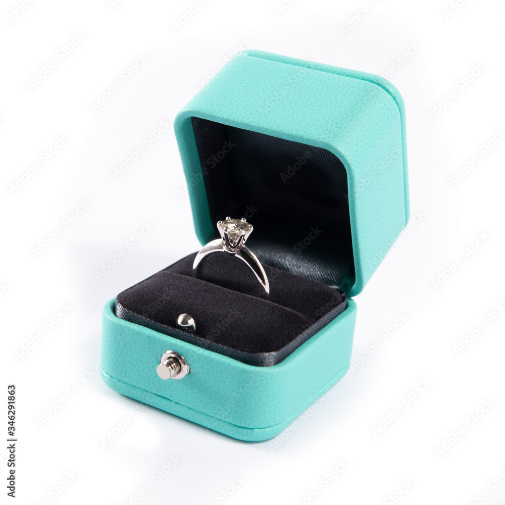 Jewelry, golden diamond ring in a box on a white background, isolated