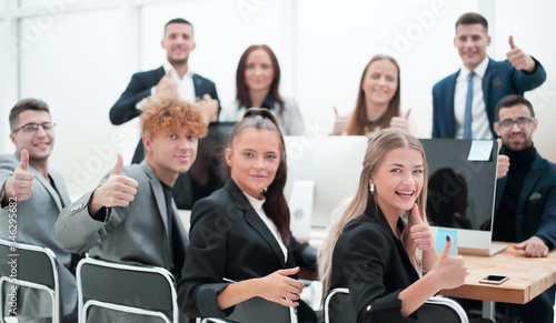 close up. smiling business team sitting at a Desk.