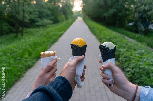 Enjoying a long walk with friends, eating ice-cream