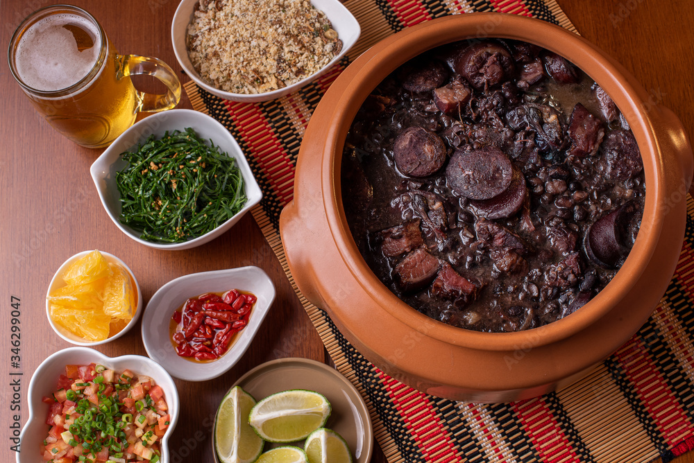 Feijoada. Typical Brazilian food with black beans, pork meat and sausage
Feijoada. Typical Brazilian food with black beans, pork meat and sausage