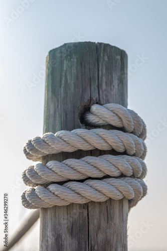 White rope around wooden post