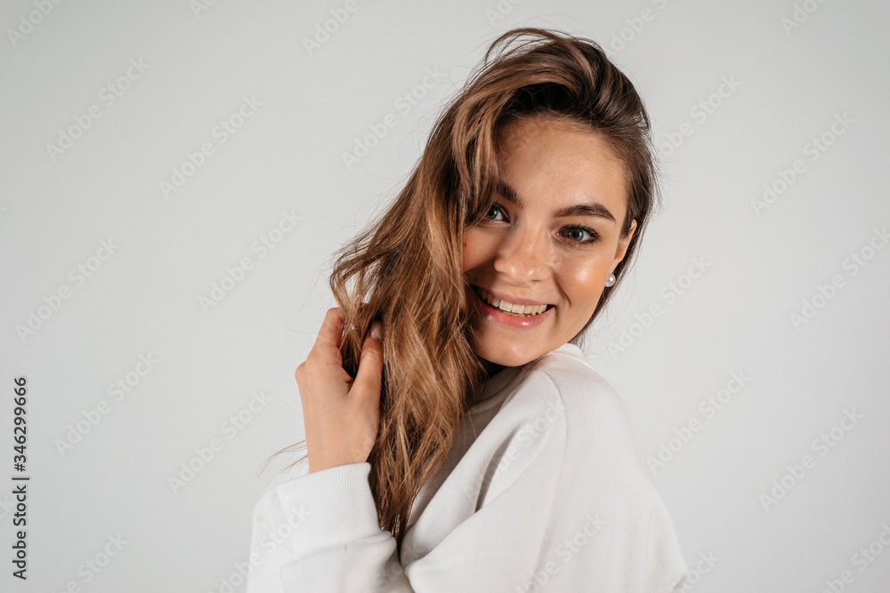 Portrait of beautiful smiling woman isolated on white background with copyspace