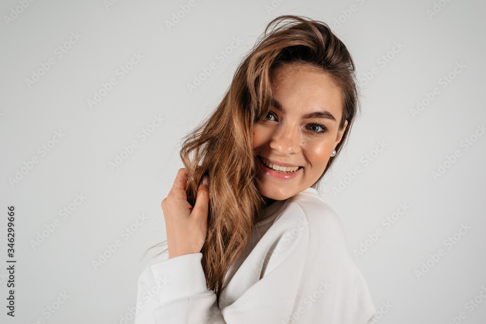 Portrait of beautiful smiling woman isolated on white background with copyspace Portrait of beautiful smiling woman isolated on white background with copyspace