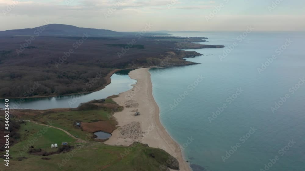 Video with panoramic morning view with one of the most beautiful wild beaches at the Black Sea coast and the mouth of Veleka river, Bulgaria... Video with panoramic morning view with one of the most beautiful wild beaches at the Black Sea coast and the mouth of Veleka river, Bulgaria...