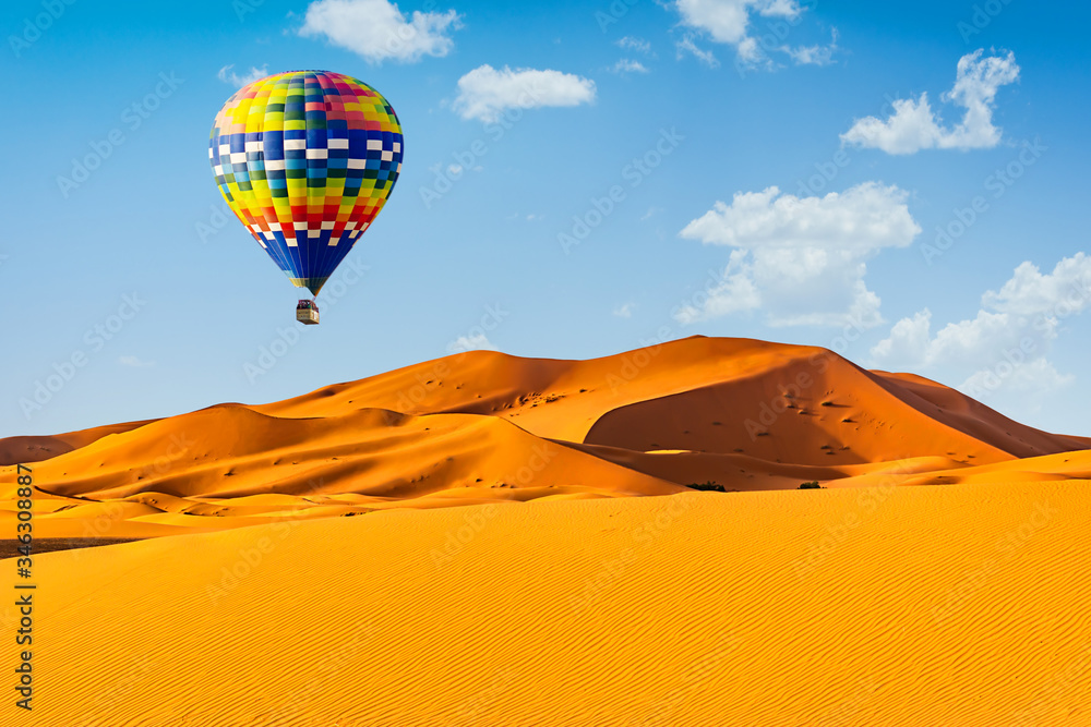 Travel concept. Amazing view of sand dunes with hot air balloons in the Sahara Desert. Location: Sahara Desert, Morocco. Artistic picture. Beauty world. Travel concept. Amazing view of sand dunes with hot air balloons in the Sahara Desert. Location: Sahara Desert, Morocco. Artistic picture. Beauty world.