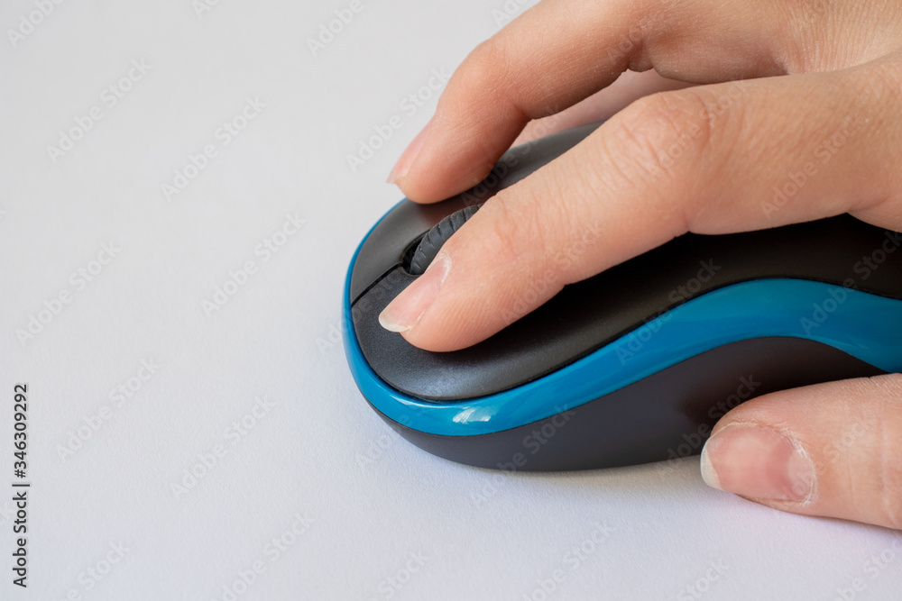 Hand on a computer mouse. Work at the computer. Technology concept. Copy space. Hand on a computer mouse. Work at the computer. Technology concept. Copy space.