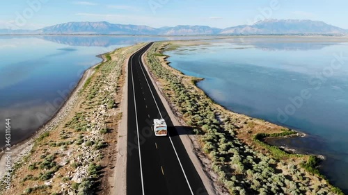 Aerial view of rv driving on Antelope Island Rd, Great Salt Lake, Utah, USA