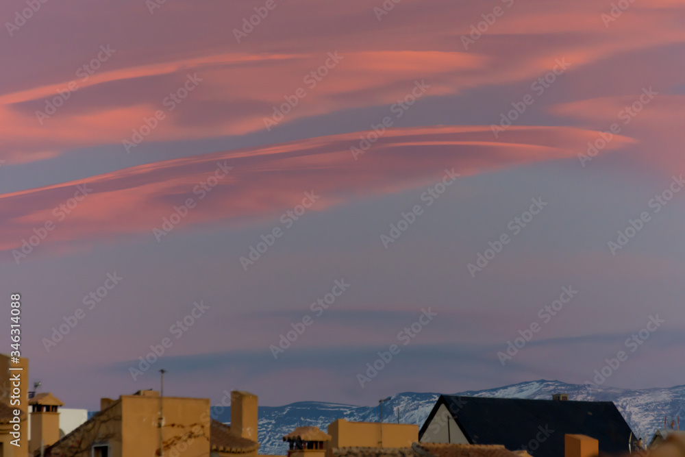 Lenticular clouds at sunset in the sky of Andalusia