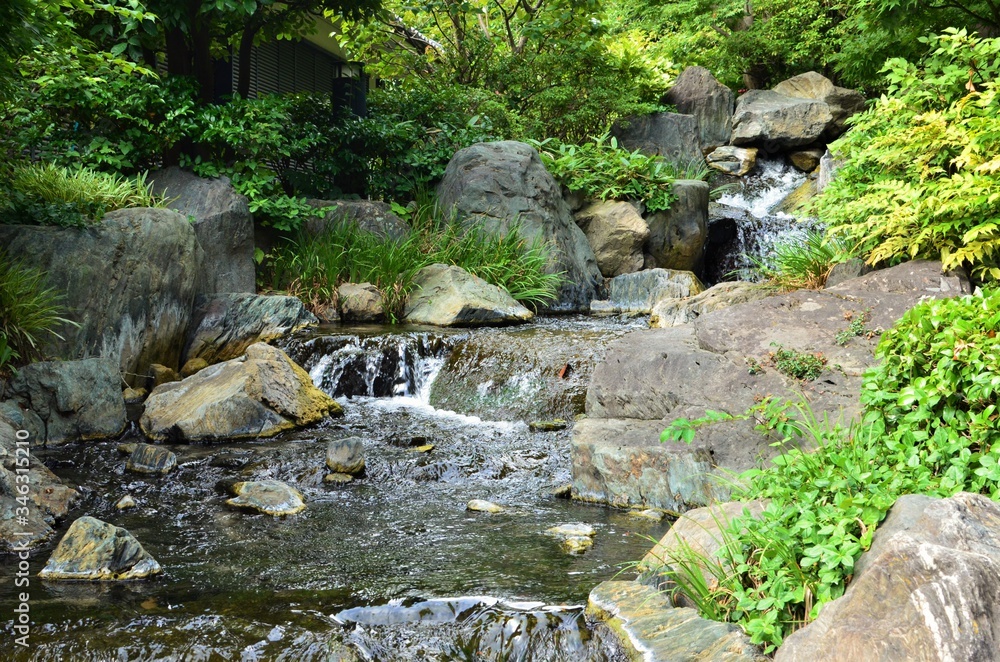 A large waterfall over a rocky cliff