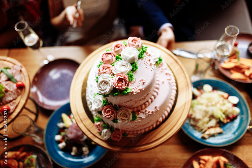 wedding cake on a wooden tray wedding cake on a wooden tray