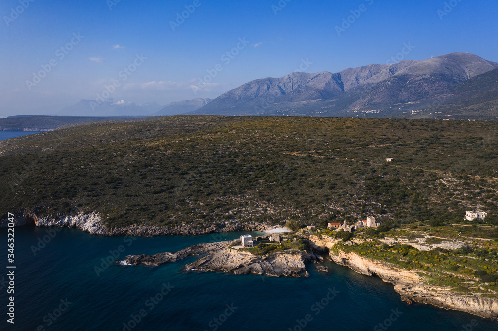 Obraz premium Aerial birds eye view photo taken by drone of fishing village of Mezapos with blue clear waters, Mani, Laconia, Peloponnese, Greece