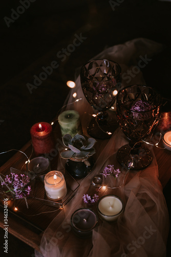 Still life of wedding decorations, candles and wine © Юлия Батаева