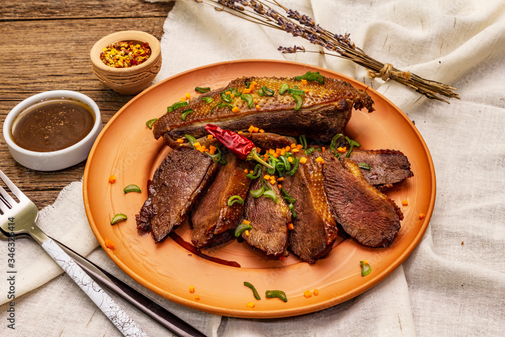 Roasted duck breasts, spices and Demiglace sauce. Traditional French