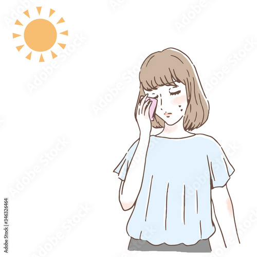 暑さに悩んでいる女性